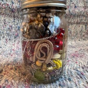 Jar filled with mystery costume jewelry.